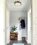 Duncan 14 Inch Two Light Flush Mount Ceiling Light Damp Rated Vintage Inspired Fixture in hallway with shoes and coat rack.