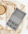 Essential Leather Jewelry Tray With Five Grid Layout For Earring Display Plate And Ring Holder Countertop Organizer on beige fabric.