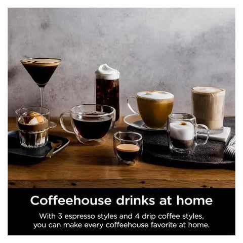 Assorted coffee drinks on a wooden table, showcasing different espresso and drip coffee styles in various glassware.
