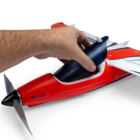Hand adjusting ElectroStreak 1.1m PNP RC Electric Airplane with modern features, detail of battery compartment and nose.