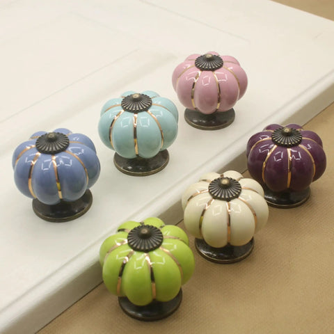 Super Slick Vintage Ceramic Pumpkin Cabinet Knobs 6 Piece Set, colorful knobs in various sizes for cabinets and dressers.
