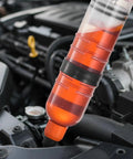 Straight Up No Drip Manual Fluid Extractor With A Legit 1500Cc Tank in use extracting oil from a car engine.