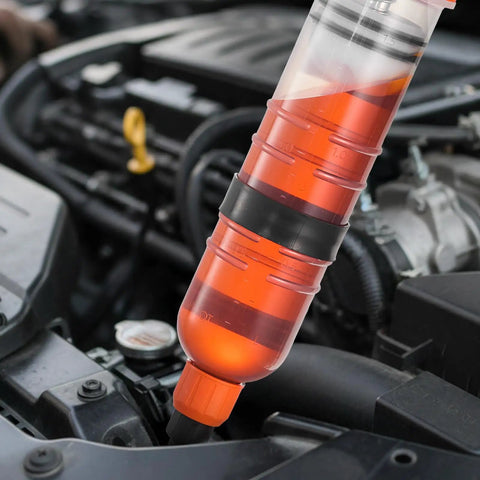 Straight Up No Drip Manual Fluid Extractor With A Legit 1500Cc Tank in use extracting oil from a car engine.