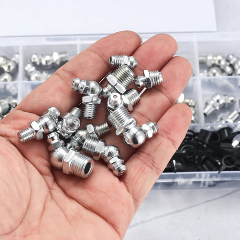 Hand holding Pro Grade 140 Piece Grease Fittings Kit Featuring 1/4 Inch And 1/8 Inch Zerk Fittings Plus M6 And M8 Sizes