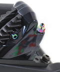 Close-up of Badass Titanium Alloy Brake Bleeder Screw Set With Dust Caps for Motorcycles on a brake caliper.
