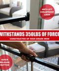 Heavy Duty Sliding Door Security Bar With Child Proof Anti Lift Lock And No Sweat Setup For Adjustable Patio And Window Defense Up To Fifty One Inches Black Steel Bar installed in sliding door, showcasing anti-lift lock mechanism.
