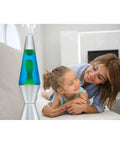 Classic 14.5 Inch Silver Base Lava Lamp With Yellow Wax In Blue Liquid For Instant Mood Lighting next to family on couch