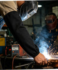 Heavy Duty Fire Retardant Welding Sleeves Featuring A Locksteady Snug Fit and Next Level Heat Resistant Arm Guards Crafted From Premium Cotton For Zero Hassle Shop Grind And Mechanic Jobs Delivered As One Pair In Classic Black during welding.