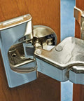 Hinge Angle Restriction Clip For 86 Degree Opening, 10 Pack, Black Nylon shown installed on Blumotion soft-close cabinet hinge
