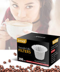 Woman drinking coffee beside a box of Irmidi Disposable Coffee Filters with coffee beans scattered around.
