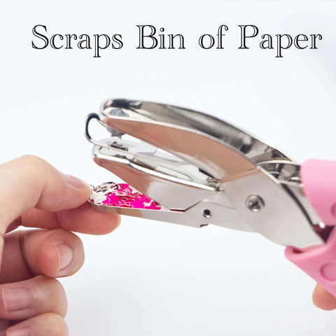 Close-up of star shaped handheld paper hole punch with soft grip pink silicone cover for crafts, 1/4 inch punch, 1.96 inch star hole.
