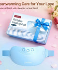 Cordless Portable Heating Pad For Period Cramps On The Go with packaging, showing wearable abdominal belt and floral setting.