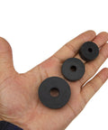 Heavy Duty Rubber Isolation Feet Pads 12 Pack Thick Anti Vibration Buffers in a hand showcasing three sizes of rubber washers.