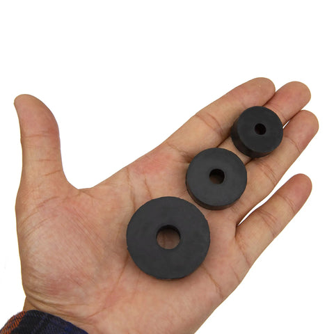 Heavy Duty Rubber Isolation Feet Pads 12 Pack Thick Anti Vibration Buffers in a hand showcasing three sizes of rubber washers.