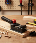 Rock Solid Woodworking Drill Guide Jig For Dead On Accurate Dowel Holes on workbench with marked alignment slots and drill bit.