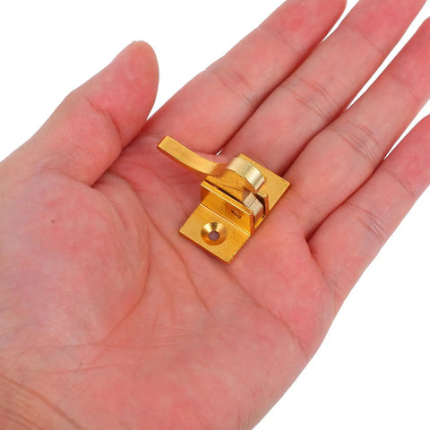 Brass Cabinet Door Latch With Spring Catch Old School Retro Style Window Security Lock in hand showcases size and golden color.