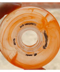 Close-up of a single orange inline skate wheel with visible inner hub, part of a set resembling Pink Inline Skate Wheels Replacement Set 72Mm 76Mm 80Mm 83A Hardness With High Rebound Bearings For Indoor Outdoor Roller Hockey And Casual Skating With Stable Ride And Shock Absorption.