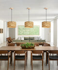 Natural Rattan Chandelier With Handwoven Wicker Pendant Light, Retro American Country Farmhouse Vibe For Dining Room Kitchen Living Room Bedroom, Ceiling Mounted Fixture, Height Adjustable For Cozy Glow in modern dining room setting.
