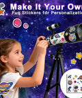 Girl decorating Totally Kid Friendly 60mm Telescope With 18x To 90x Magnification, Sturdy Tripod, Two Eyepieces And Finder Scope.