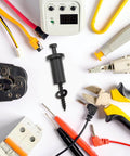 Assorted electrical tools and connectors on white background with screw-in focus in center