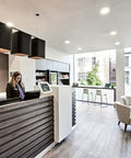 Meconard 6 Pack 3 Inch 5CCT LED Recessed Lighting in modern reception area with sleek design and natural lighting.
