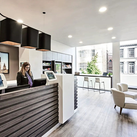 Meconard 6 Pack 3 Inch 5CCT LED Recessed Lighting in modern reception area with sleek design and natural lighting.