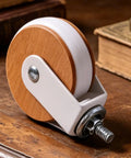 Heavy Duty Casters 4 Pieces M8 Threaded Heavy Duty Silent Replacements close-up on wooden surface showing wheel design and metal fitting.