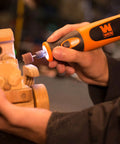 Cordless Rotary Tool Kit With 7.2V Li Ion Power, Variable Speed From 5,000 To 25,000 RPM, 24 Piece Accessory Set in use on wooden model