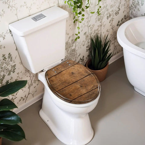 Round Overhead view brown wooden table Toilet Seat on a white toilet in a stylish bathroom setting with plants.