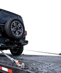 Heavy Duty 2 Inch By 96 Inch Car Tie Downs With Twisted Snap Hooks securing a car on a trailer for transport
