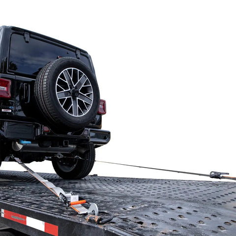 Heavy Duty 2 Inch By 96 Inch Car Tie Downs With Twisted Snap Hooks securing a car on a trailer for transport