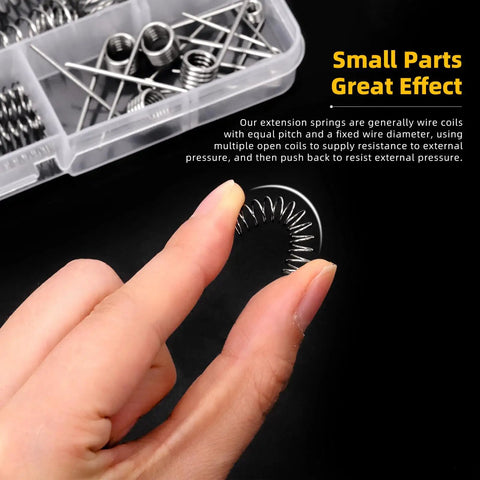 Hand holding a spring from Tower Conical Spring Set 148-Piece With Assorted Taper Springs In 0.3 0.4 0.5 0.7 0.8 1.0 1.5mm