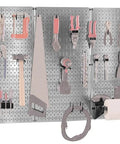 4-Foot Metal Pegboard Tool Organizer Kit with galvanized toolboard and black accessories, tools neatly arranged in a garage setting.
