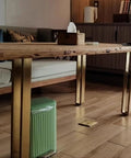 Gold finish stainless steel furniture legs from Beefy 4 Pack Heavy Duty Adjustable 60 to 110 cm supporting a wooden table