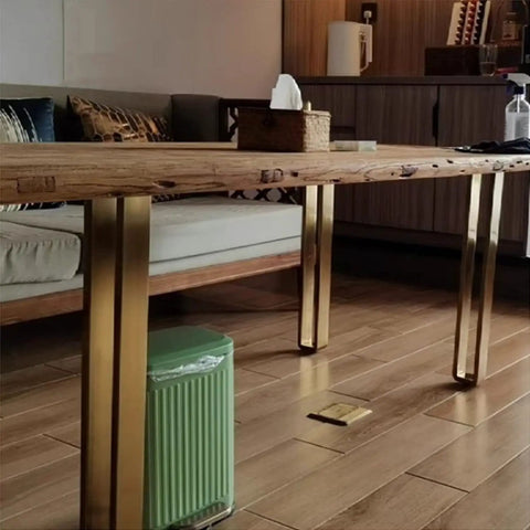 Gold finish stainless steel furniture legs from Beefy 4 Pack Heavy Duty Adjustable 60 to 110 cm supporting a wooden table