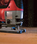 Close-up of Top Notch 6.2 Amp Orbital Jig Saw Boasting Tool Free Blade Swap and Seven Setting Speed Dial cutting wood.