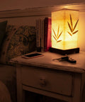 Japanese Lantern Bamboo Table Lamp With Cherry Blossom Accent on bedroom nightstand