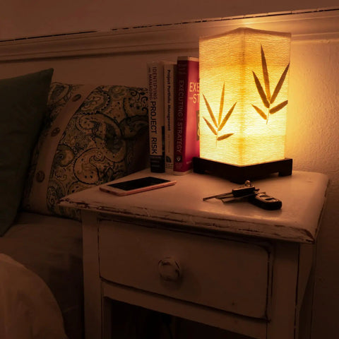 Japanese Lantern Bamboo Table Lamp With Cherry Blossom Accent on bedroom nightstand