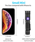 Pro Grade 395Nm UV Black Light Flashlight USB Rechargeable Handheld With Clip next to an iPhone Xs for size comparison