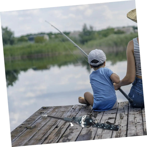 Pocket Size Baitcasting Rod Kit With Telescopic Rod And Included Reel And Line next to a child and adult fishing by a lake.