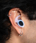 Close-up of ear with waterproof ear plug for swimming and watersports that really work, comfortable fit for men women and kids