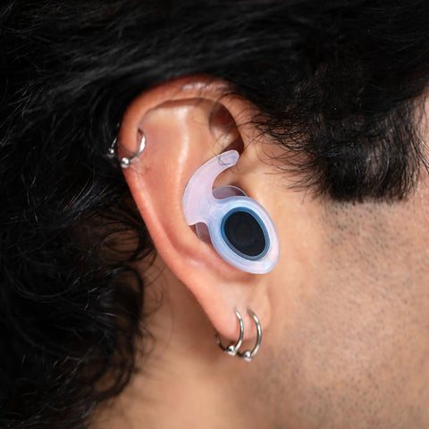 Close-up of ear with waterproof ear plug for swimming and watersports that really work, comfortable fit for men women and kids