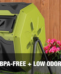 Close-up of an Outdoor Tumbling Composter Bin with Dual 360 Degree Rotation and 42 Gallon Capacity, in garden setting.