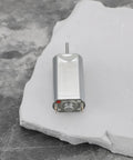 Single motor from 5 Pack Quiet DC Toy Motors 6V-9V High Speed 14000 RPM Replacement Part FF-050SK-11170 on concrete surface