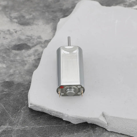 Single motor from 5 Pack Quiet DC Toy Motors 6V-9V High Speed 14000 RPM Replacement Part FF-050SK-11170 on concrete surface