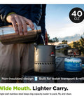 User pouring water from No Sweat Wide Mouth Stainless Steel Water Bottle With Loop Cap 40 Oz Non Insulated BPA Free into a pot.