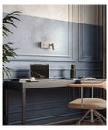 Slick LED Wall Sconces Infinite Dimming Switch Metallic Nickel Aluminum Build illuminating a modern home office desk.