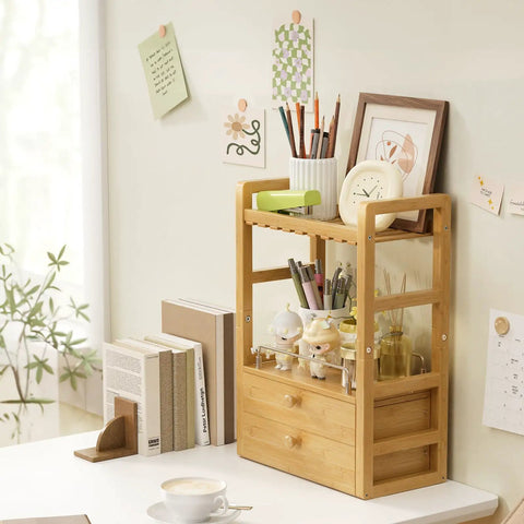 Bamboo Bathroom Countertop Organizer With 2 Tier Makeup Storage And 2 Drawers, compact eco-friendly shelf on desk with decor items.