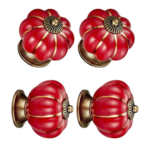 Hand Painted Red Ceramic Pumpkin Cabinet Knobs Set Of Four With Steel Screws For Kitchen Drawers And Vanities viewed from different angles.