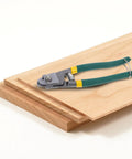 Pro Multi-Functional Cable Stripping Pliers With Ergonomic Handle For Precise Wire Gauge Adjustment on wooden surface.